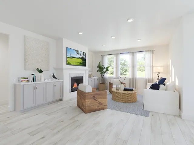 a kitchen with stainless steel appliances kitchen island granite countertop a kitchen island a stove a refrigerator and white cabinets with wooden floor