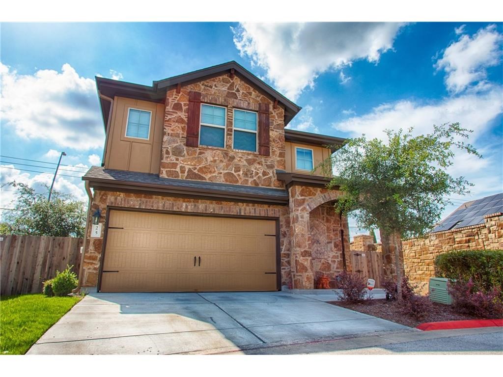 7233 Menchaca Road, Unit 25 Austin, TX 78745 - Photo 1 of 1 a front view of a house with a yard