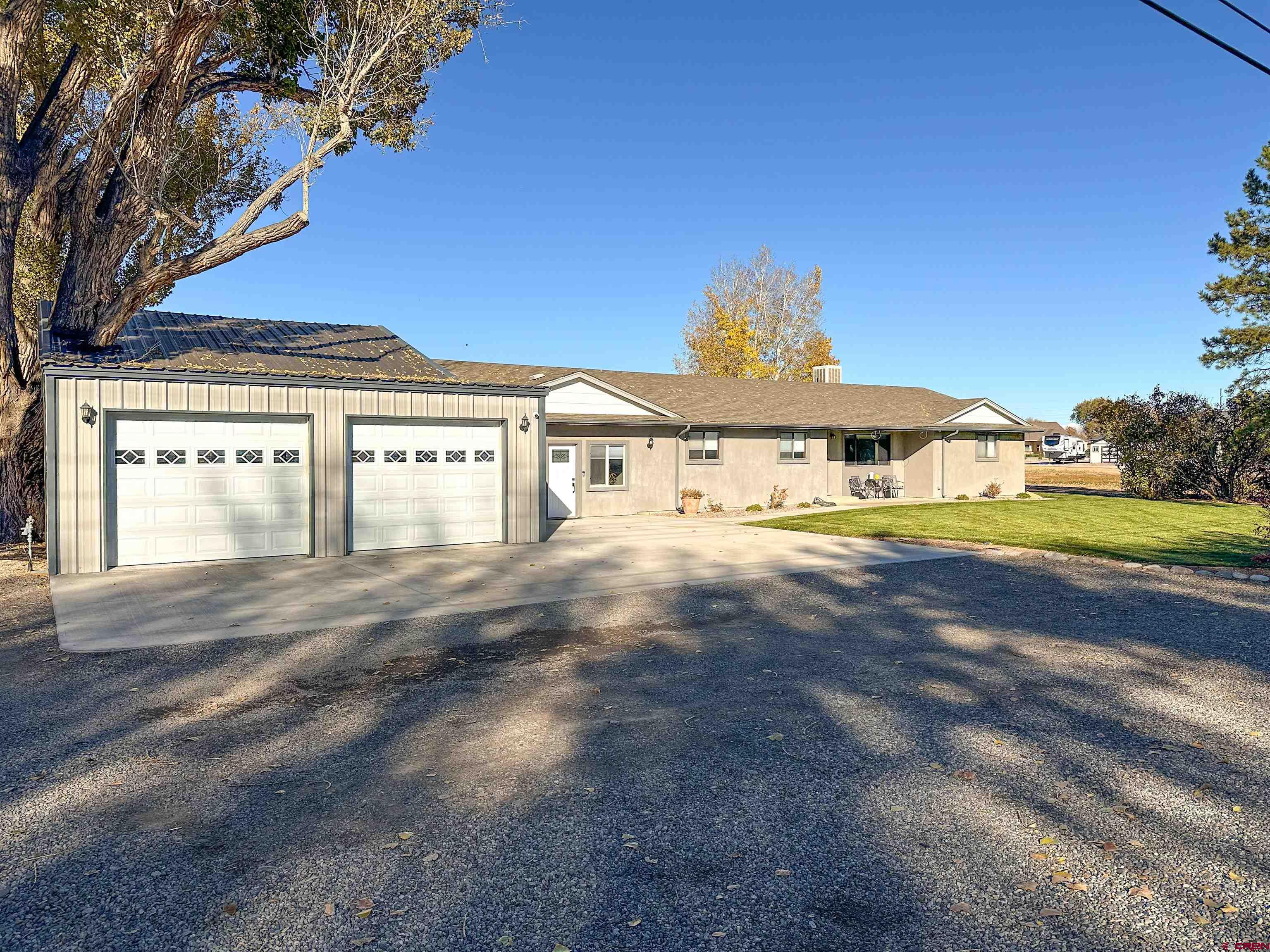 18555 F Road Delta, CO 81416 - Photo 2 of 43 a view of front of house with swimming pool