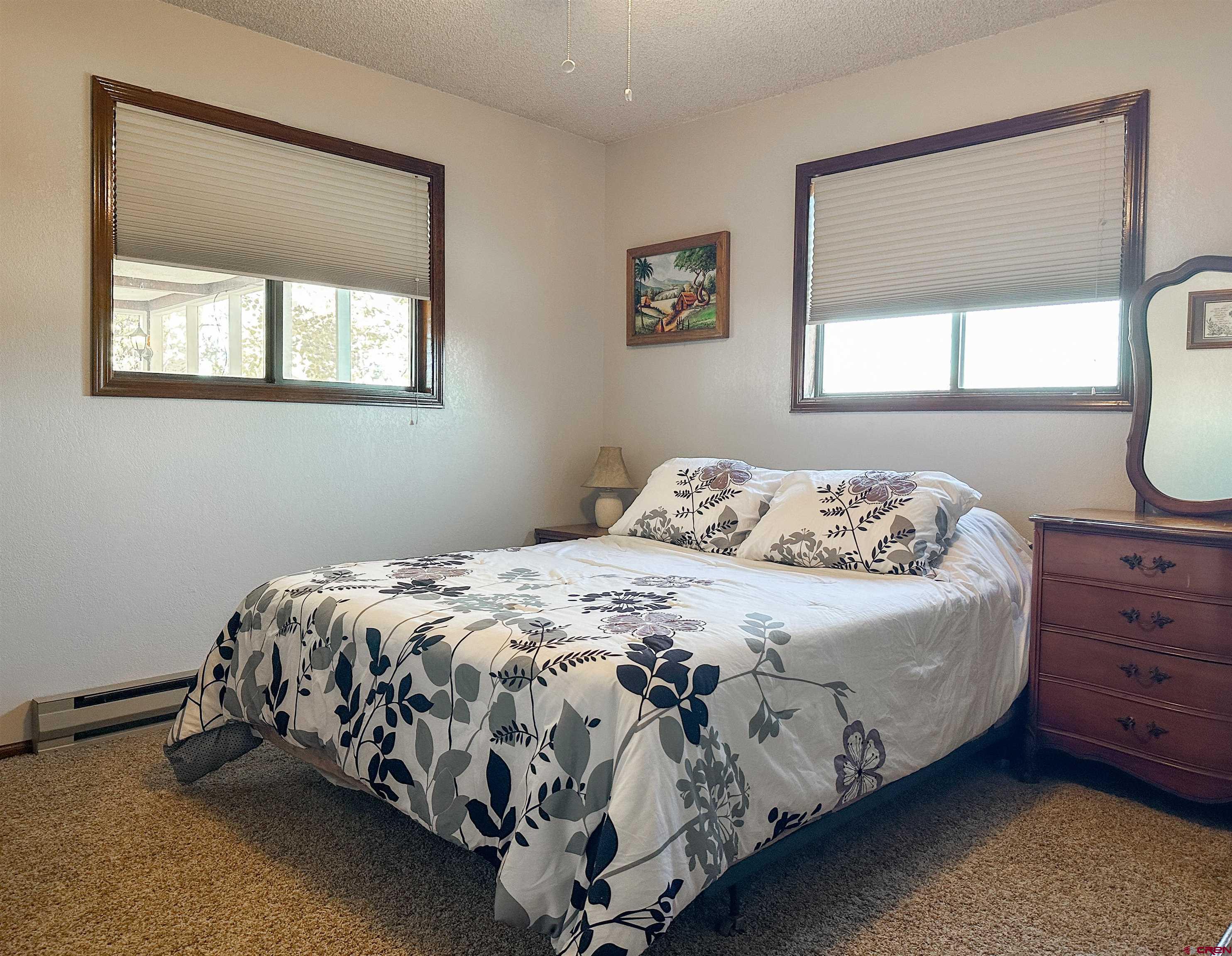18555 F Road Delta, CO 81416 - Photo 21 of 43 a bedroom with a bed and a window