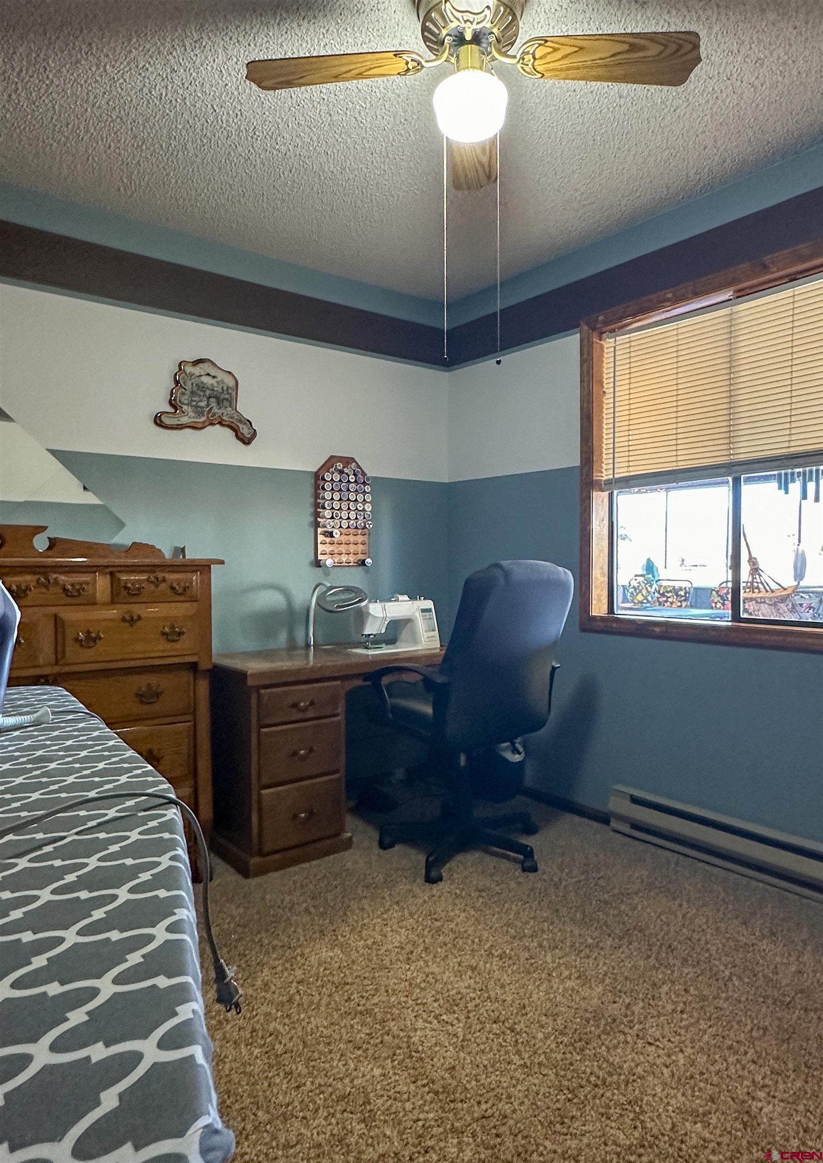 18555 F Road Delta, CO 81416 - Photo 22 of 43 a room with furniture and a chandelier