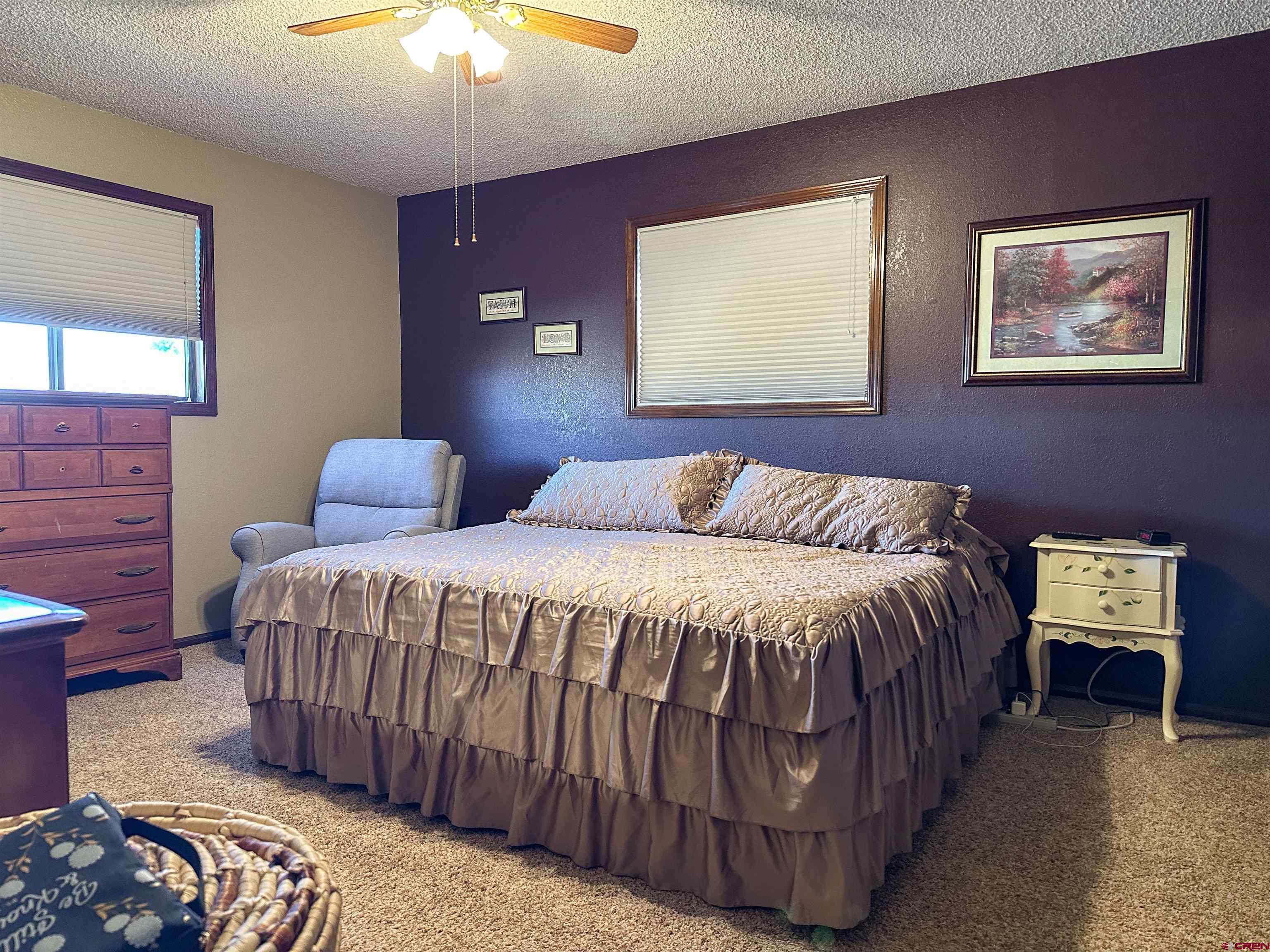 18555 F Road Delta, CO 81416 - Photo 23 of 43 a bedroom with bed and window