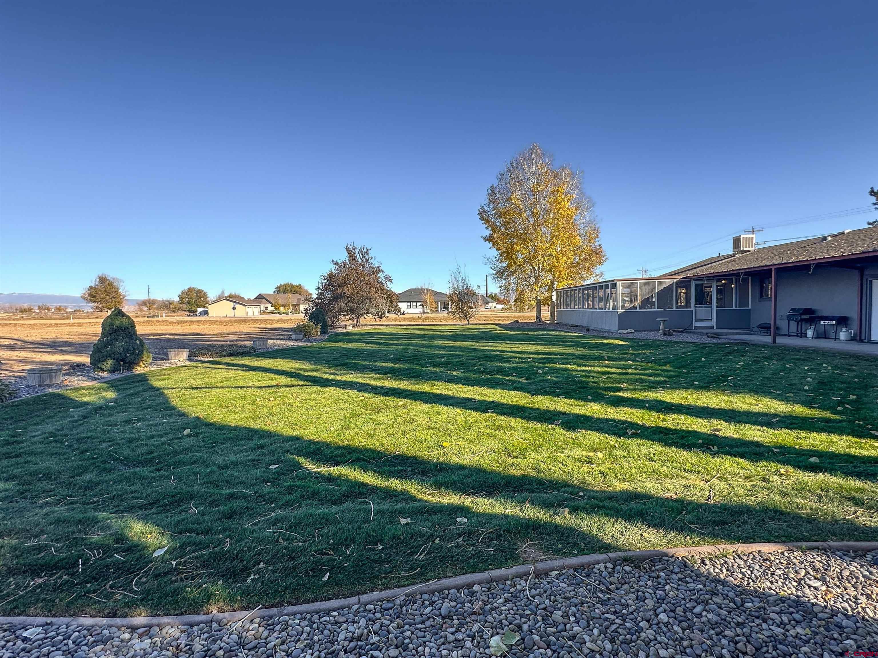 18555 F Road Delta, CO 81416 - Photo 29 of 43 a view of a house with a big yard