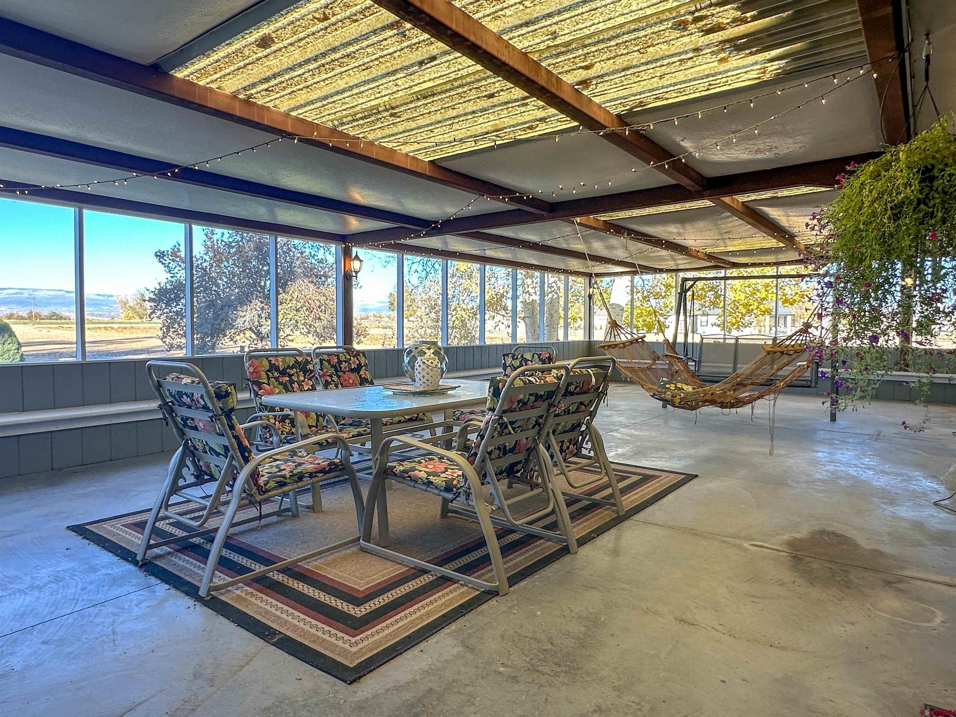 18555 F Road Delta, CO 81416 - Photo 40 of 43 a dining room with furniture and wooden floor