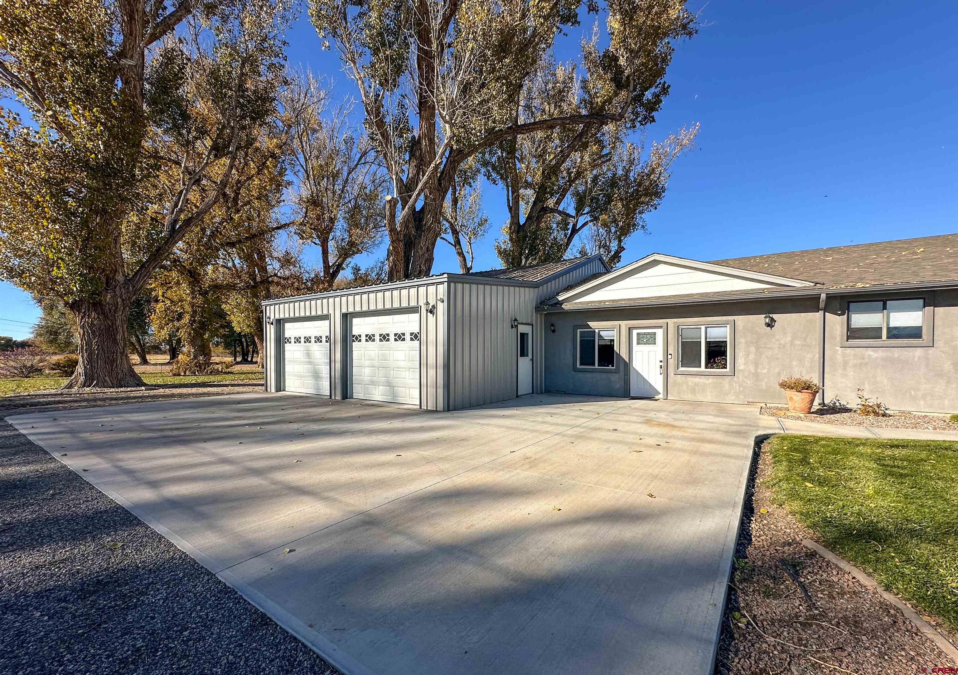 18555 F Road Delta, CO 81416 - Photo 4 of 43 a front view of a house with a yard