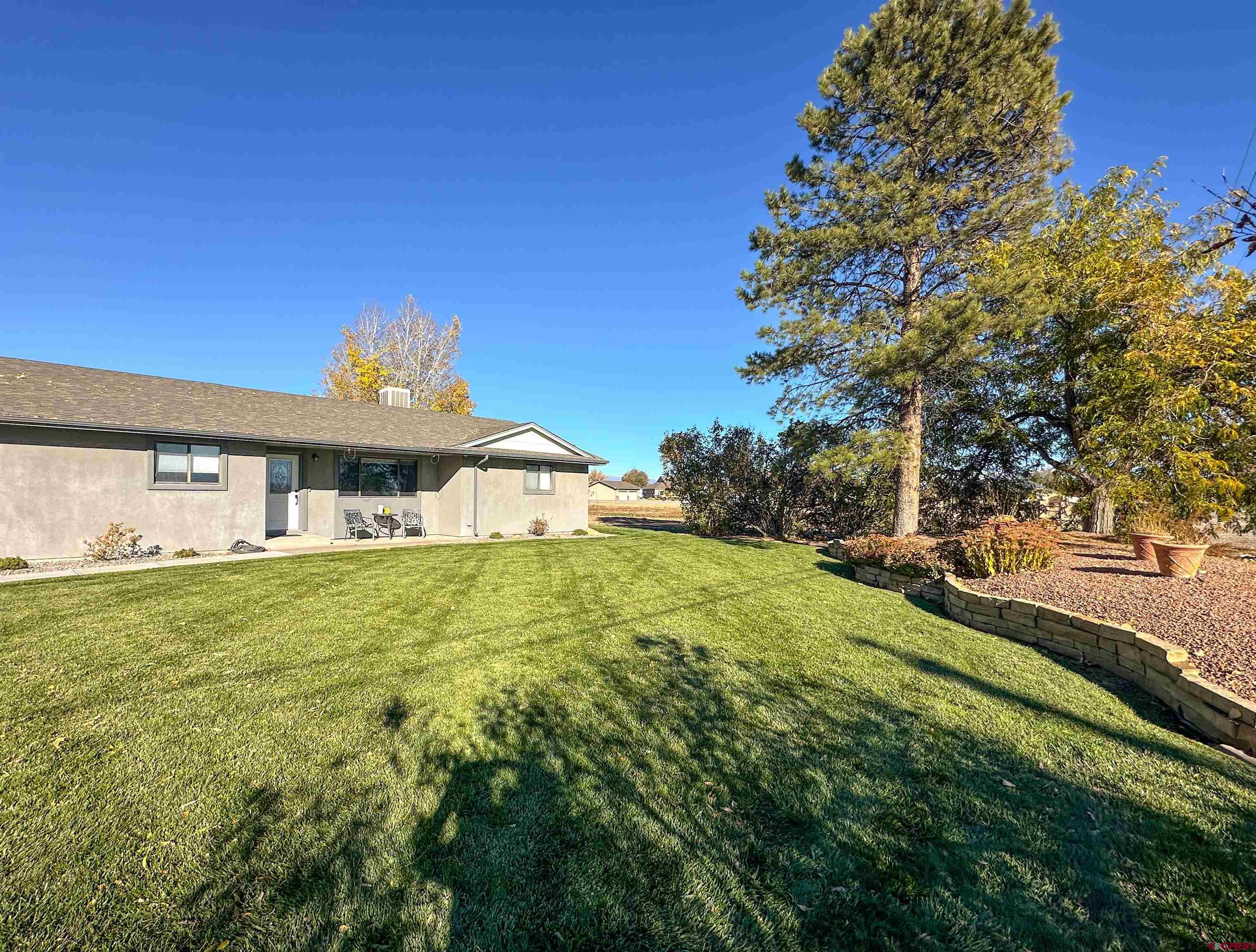 18555 F Road Delta, CO 81416 - Photo 6 of 43 a view of a house with a yard