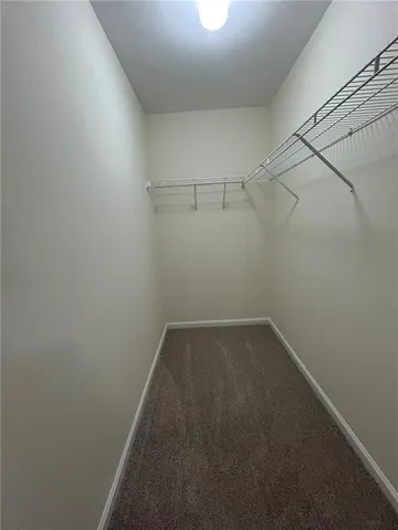 a bathroom with a double vanity sink a toilet and a mirror