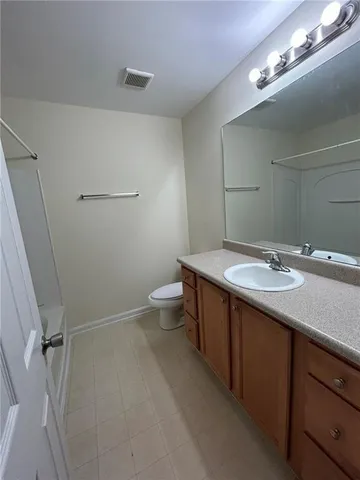 a bathroom with a shower and a bath tub