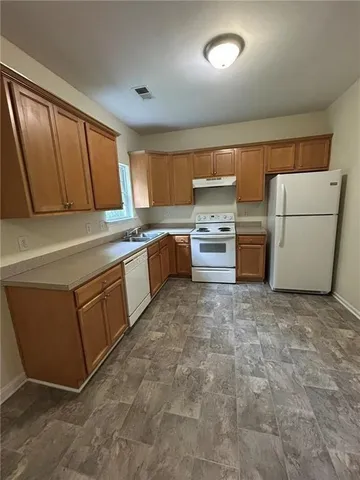 a room with furniture a washer and dryer