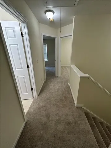 wooden floor in an empty room with a mirror