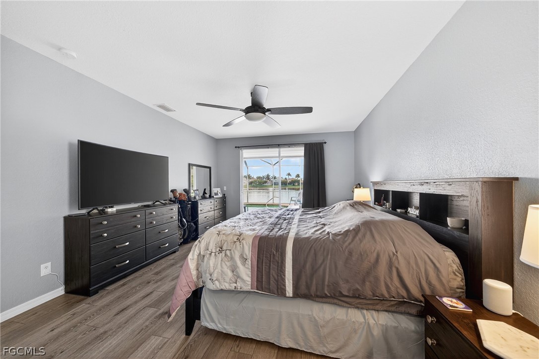 8313 Sumner Avenue Fort Myers, FL 33908 - Photo 19 of 42 a bed room with a bed and a television