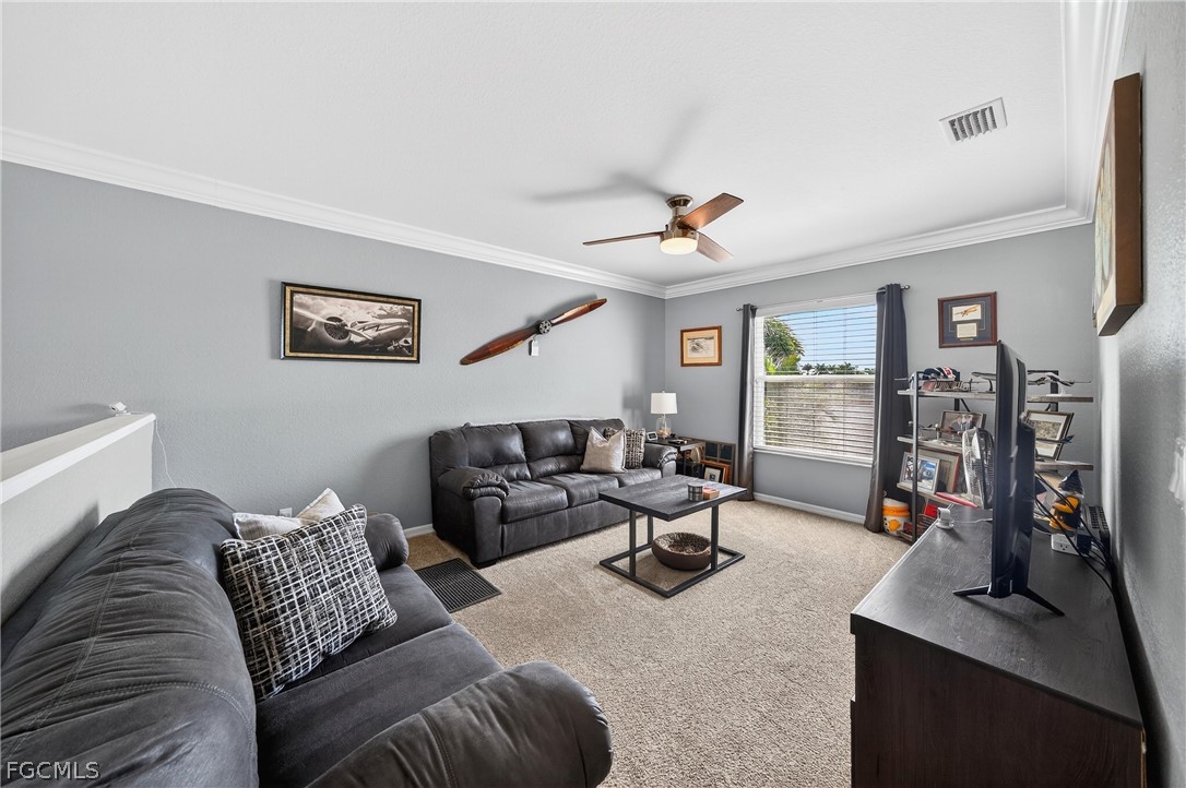 8313 Sumner Avenue Fort Myers, FL 33908 - Photo 22 of 42 a living room with furniture kitchen view and a window