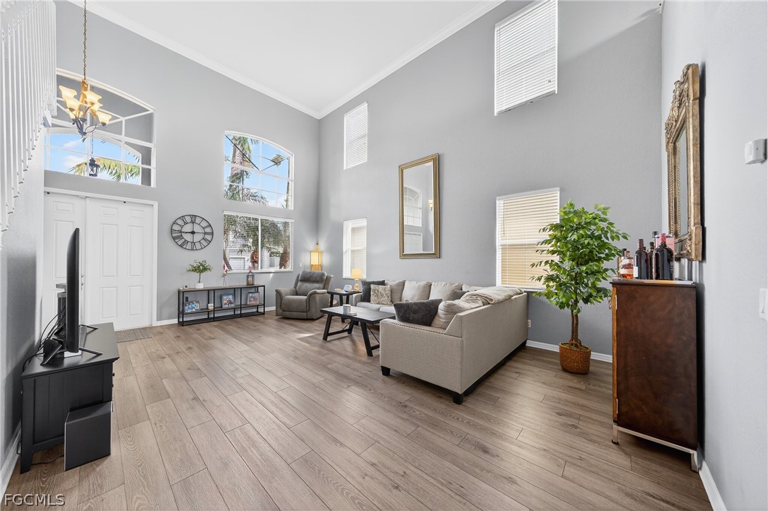 8313 Sumner Avenue Fort Myers, FL 33908 - Photo 4 of 42 a living room with furniture and a flat screen tv