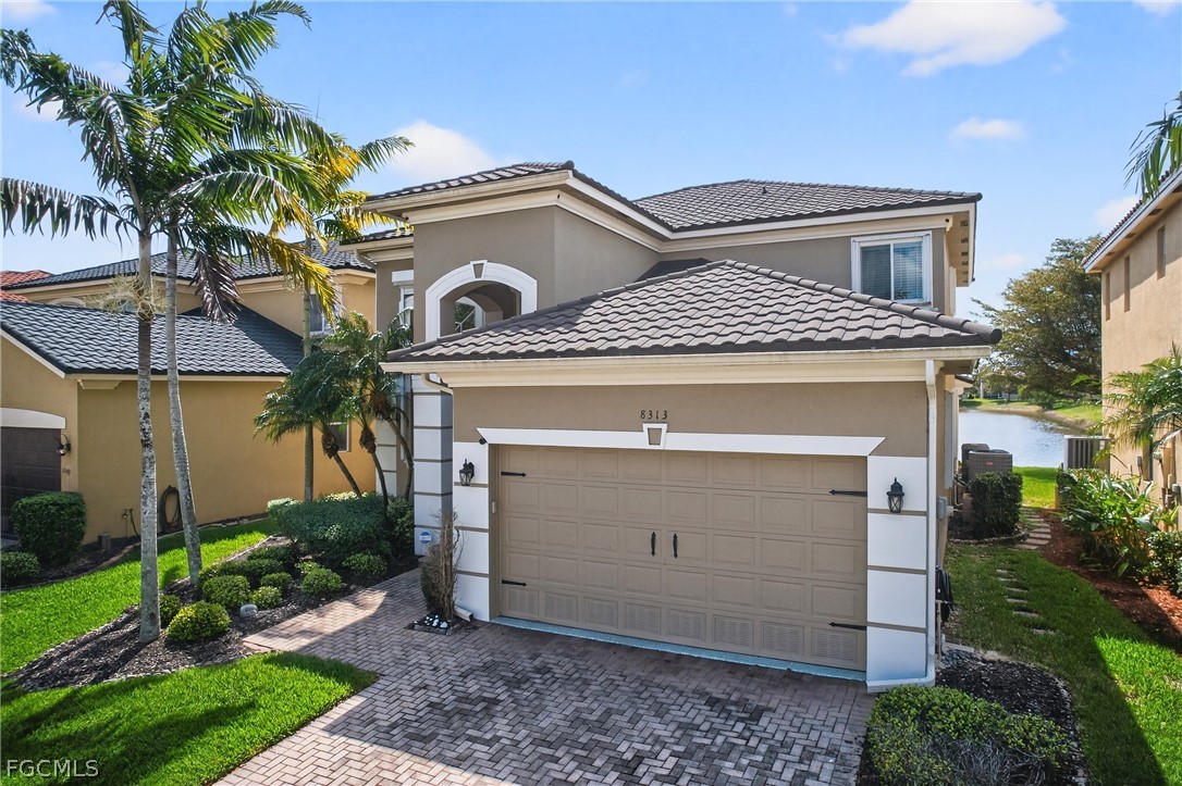 8313 Sumner Avenue Fort Myers, FL 33908 - Photo 41 of 42 a front view of a house with a garden