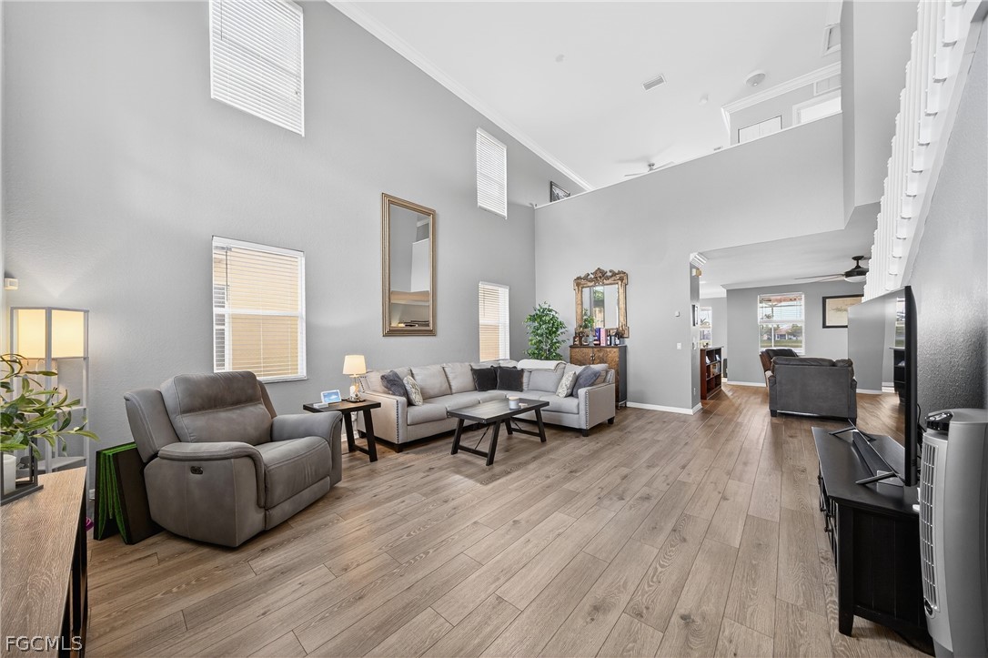 8313 Sumner Avenue Fort Myers, FL 33908 - Photo 5 of 42 a living room with furniture and a wooden floor