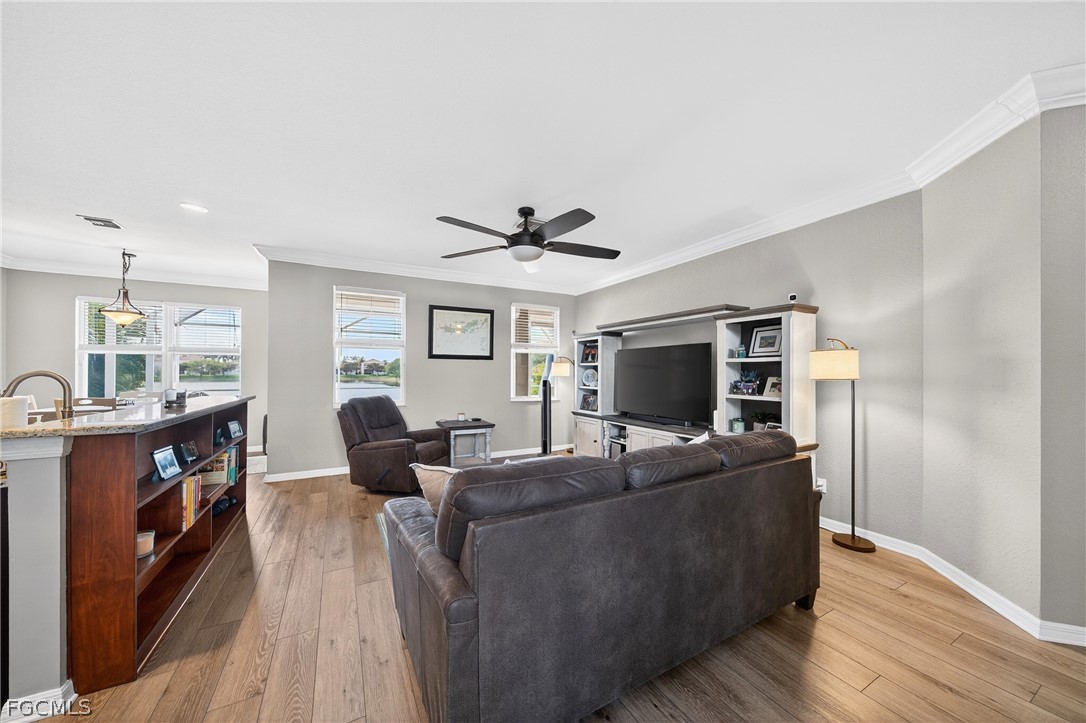 8313 Sumner Avenue Fort Myers, FL 33908 - Photo 6 of 42 a living room with furniture and a flat screen tv