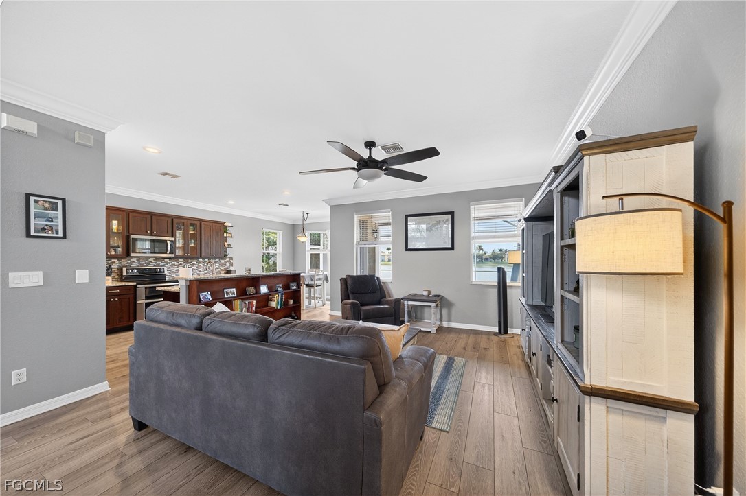 8313 Sumner Avenue Fort Myers, FL 33908 - Photo 7 of 42 a living room with furniture and a large window