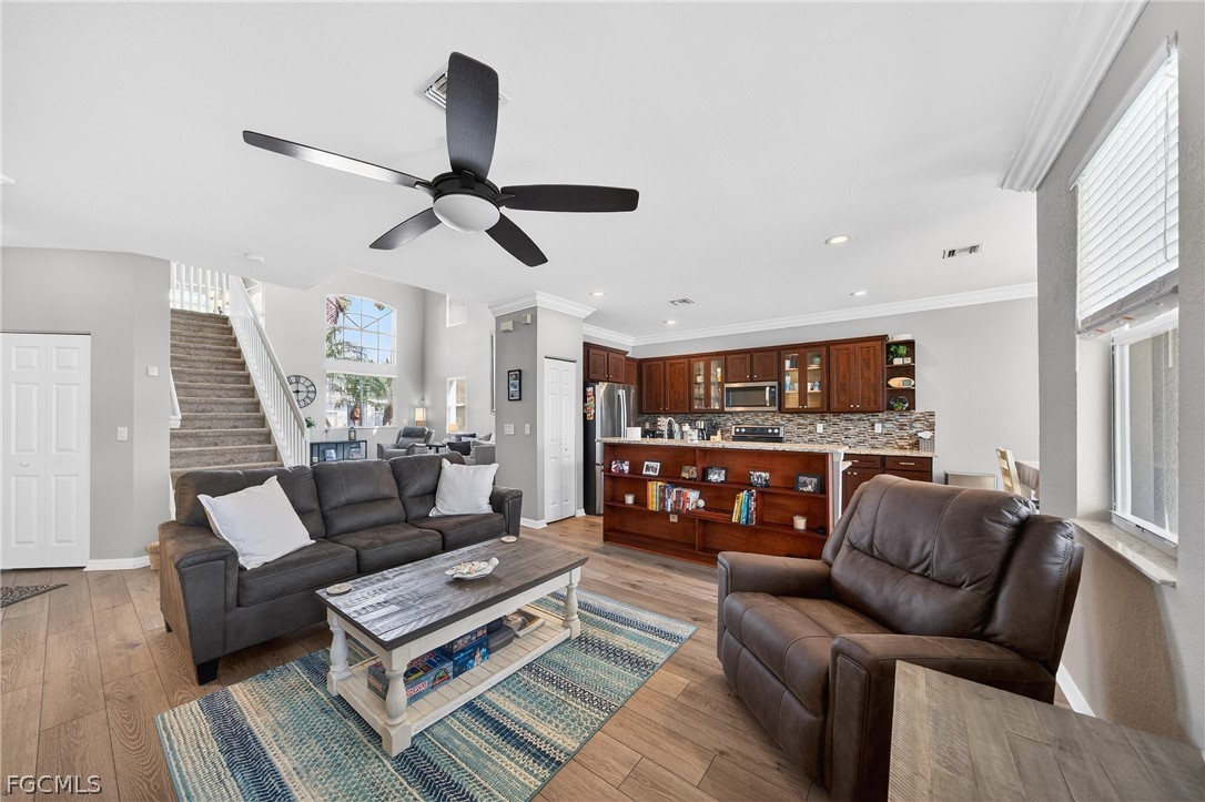 8313 Sumner Avenue Fort Myers, FL 33908 - Photo 8 of 42 a living room with furniture and a ceiling fan