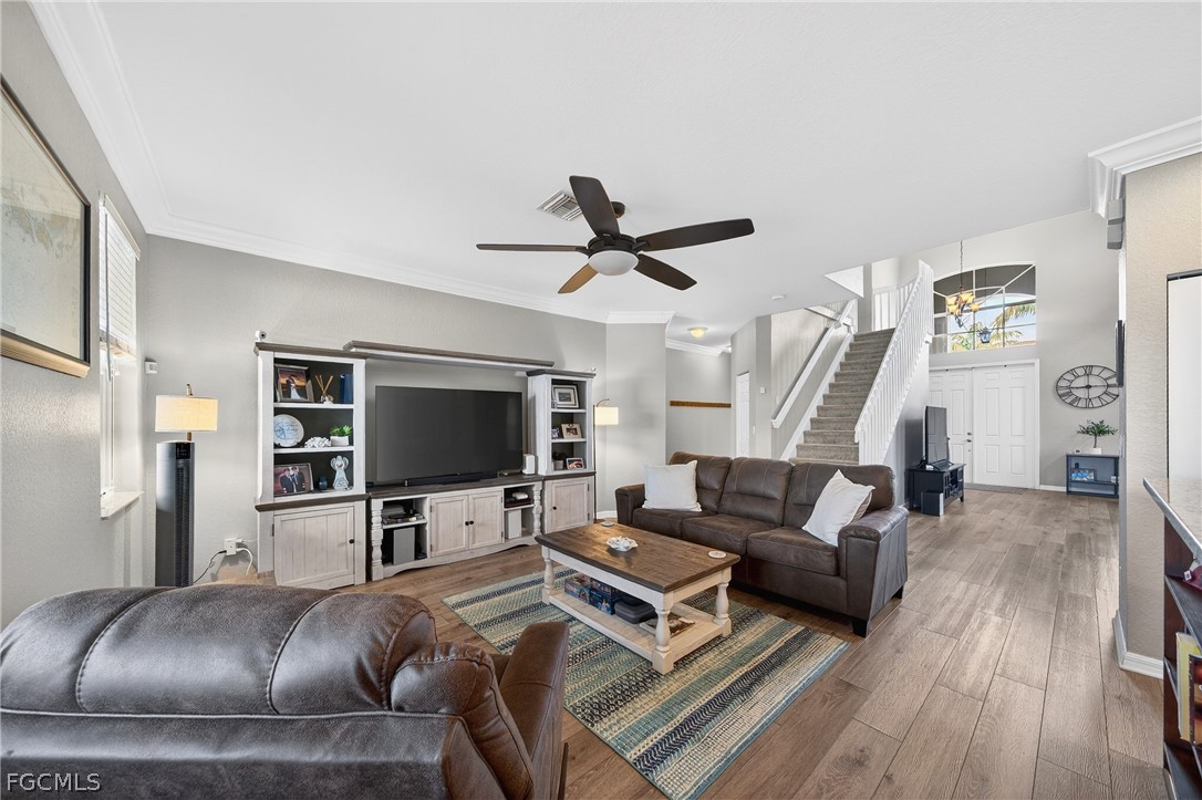 8313 Sumner Avenue Fort Myers, FL 33908 - Photo 9 of 42 a living room with furniture and a flat screen tv