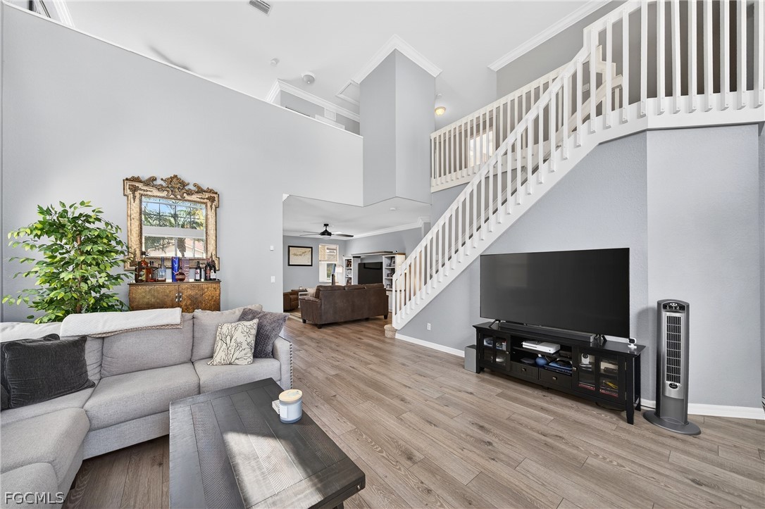 8313 Sumner Avenue Fort Myers, FL 33908 - Photo 10 of 42 a living room with furniture and a flat screen tv