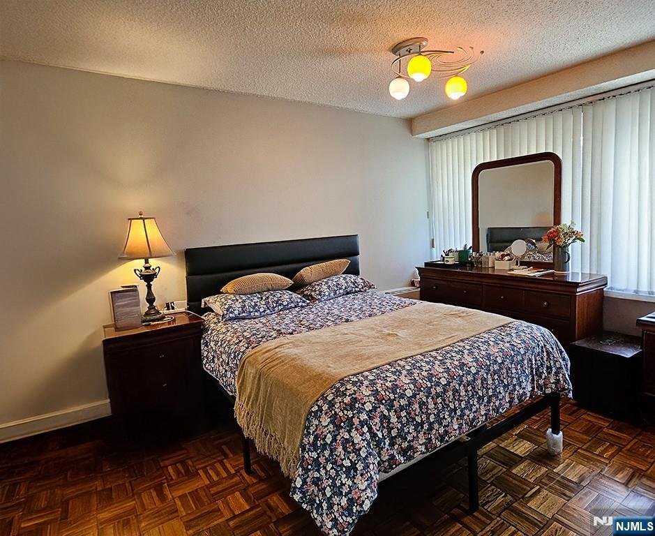 277 Prospect Avenue, Unit 4H Hackensack, NJ 07601 - Photo 15 of 19 a bedroom with a bed and window