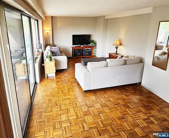 a living room with furniture and a rug