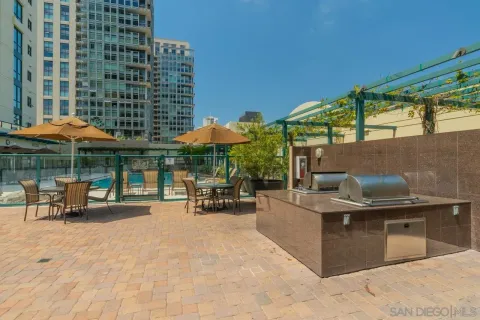 a view of a patio with a table and chairs