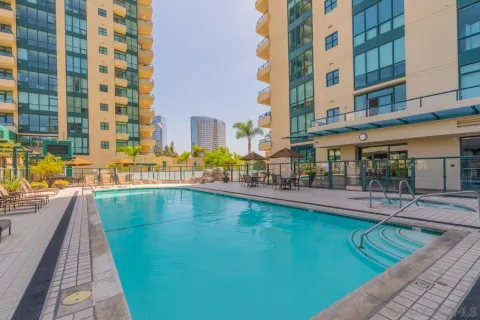 a view of a swimming pool with a lounge chair