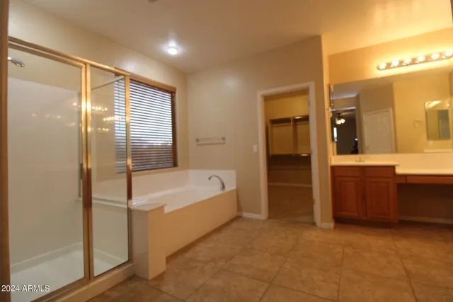 a bathroom with a bathtub and a sink