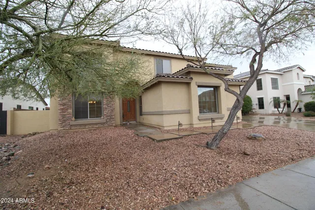 a view of a house with a yard and garage
