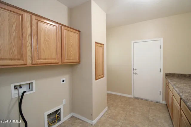a view of cabinets with washer and dryer