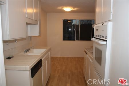 3111 4th Street, Unit 309 Santa Monica, CA 90405 - Photo 2 of 10 a bathroom with a sink and a mirror
