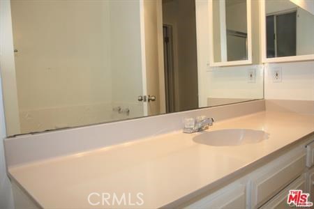 3111 4th Street, Unit 309 Santa Monica, CA 90405 - Photo 5 of 10 a bathroom with a granite countertop sink and a bathtub