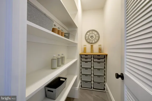 a view of a hallway with seating area