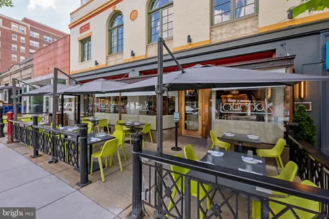 a view of a building with sitting area