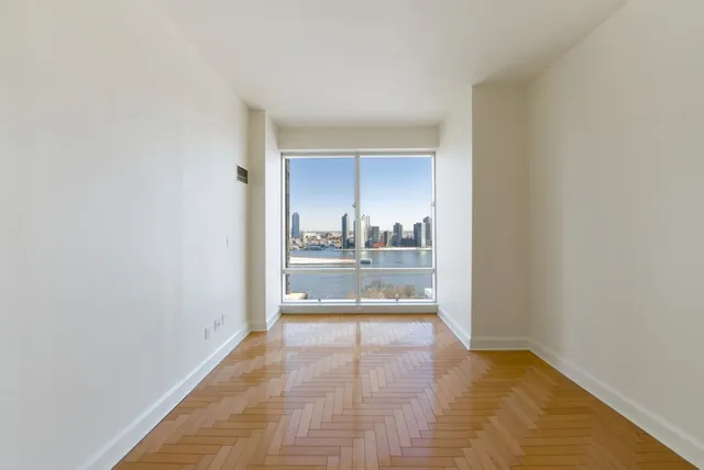 a view of an empty room and window