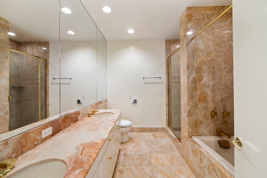 845 United Nations Plaza, Unit 15A Manhattan, NY 10017 - Photo 4 of 8 a spacious bathroom with a bathtub and shower