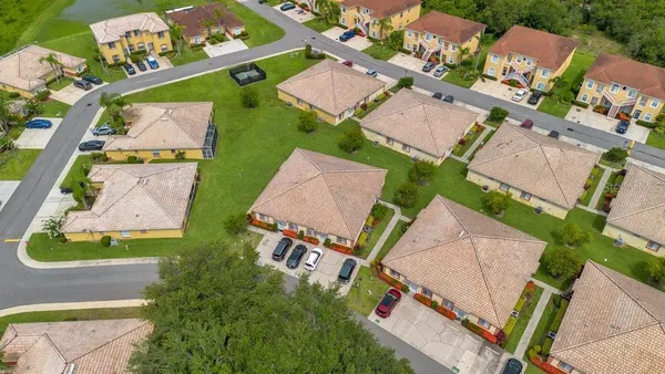 an aerial view of a house with a garden