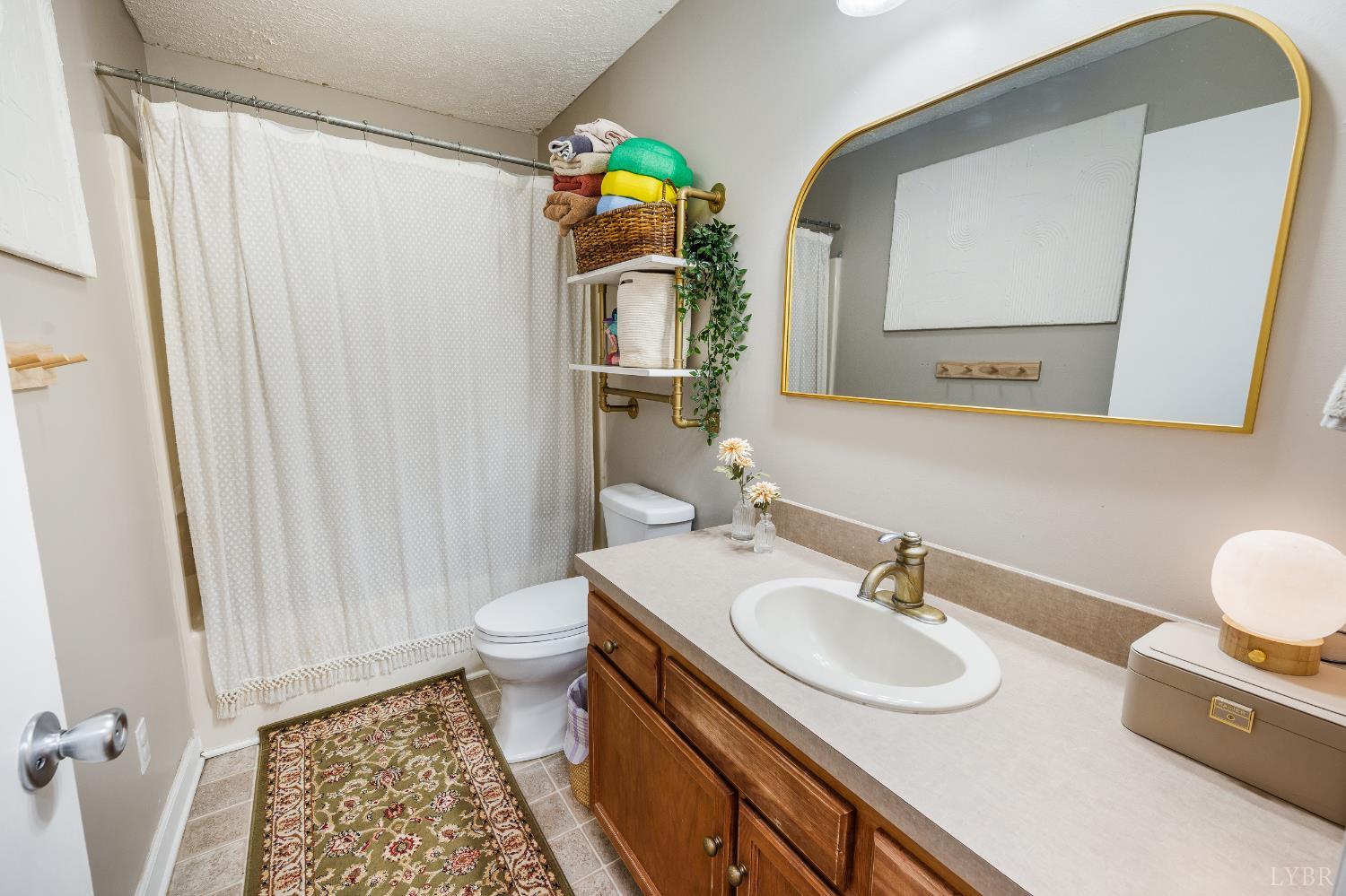 778 Doss Road Concord, VA 24538 - Photo 12 of 42 a bathroom with a sink a toilet and a mirror