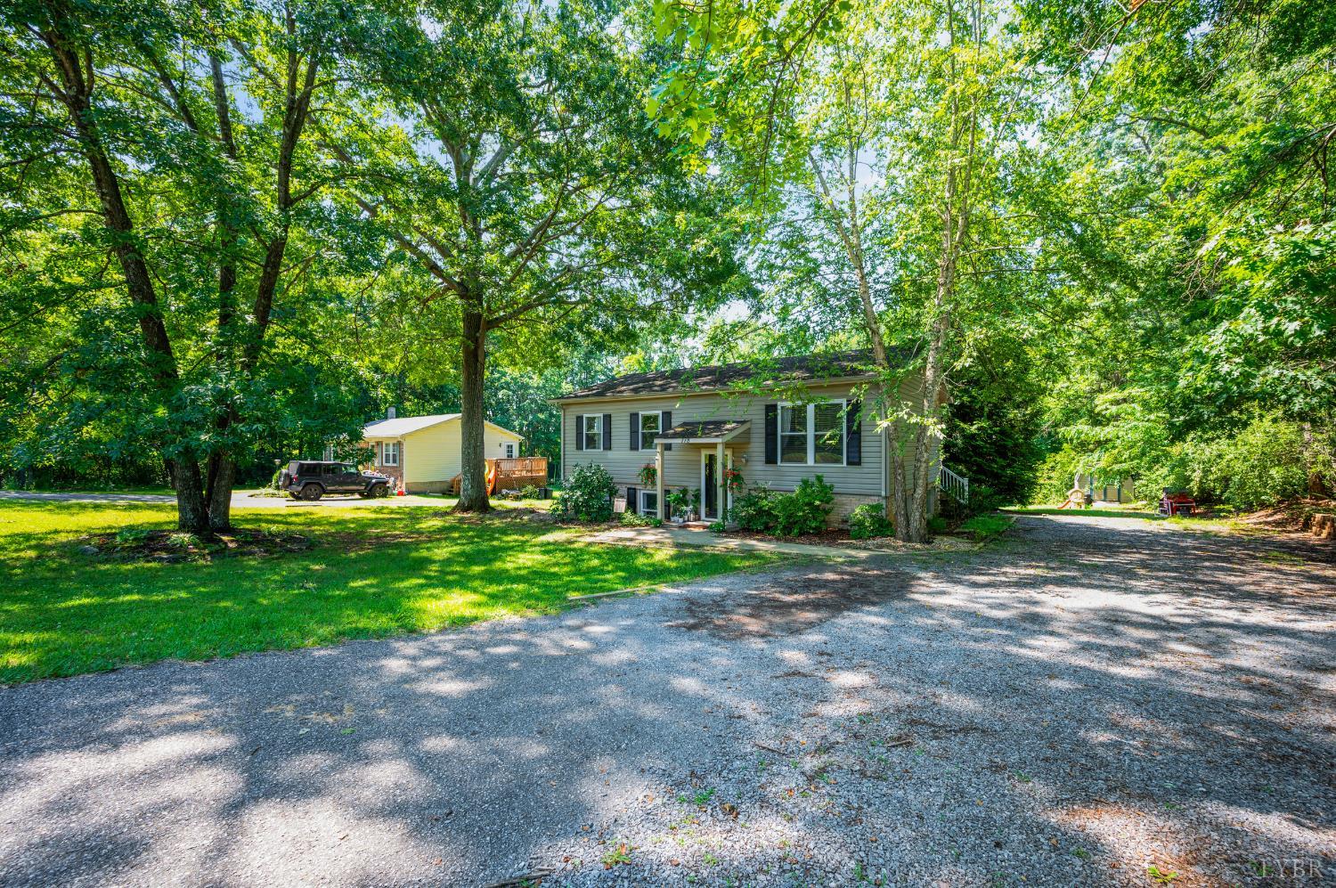 778 Doss Road Concord, VA 24538 - Photo 29 of 42 a front view of a house with a yard and a tree
