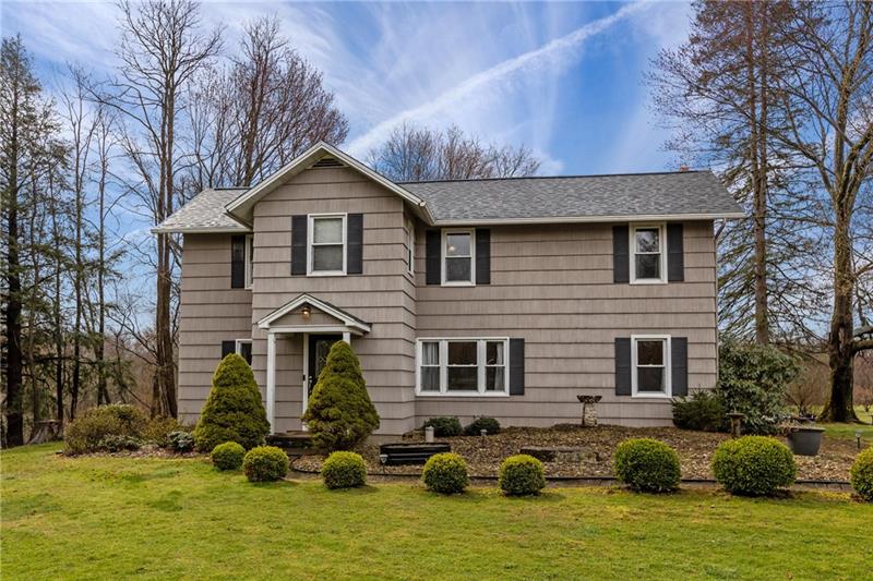 100 Daugherty Road Grove City, PA 16127 - Photo 1 of 48 a front view of house with yard and trees in the background