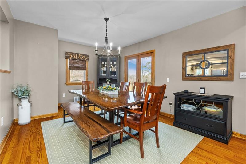100 Daugherty Road Grove City, PA 16127 - Photo 12 of 48 a dining room with furniture a chandelier and wooden floor