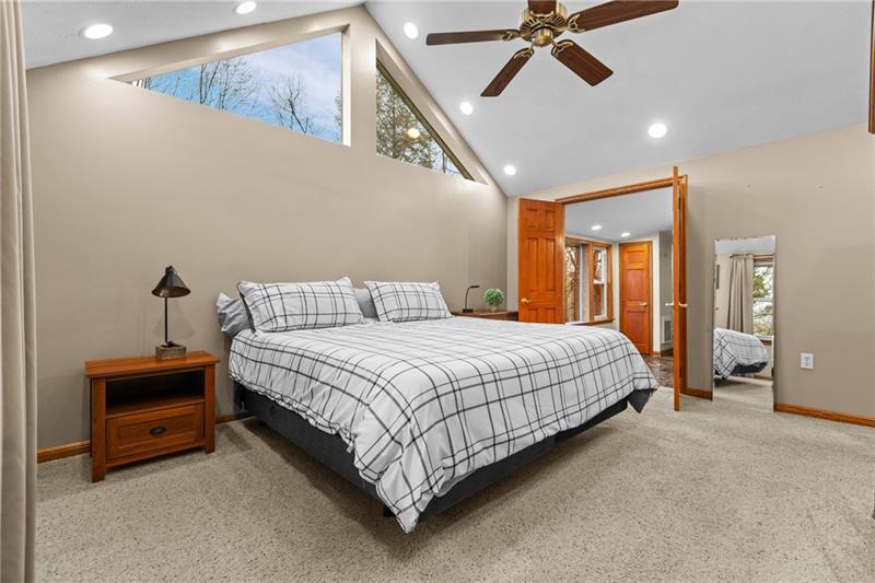 100 Daugherty Road Grove City, PA 16127 - Photo 21 of 48 a spacious bedroom with a bed and a chandelier