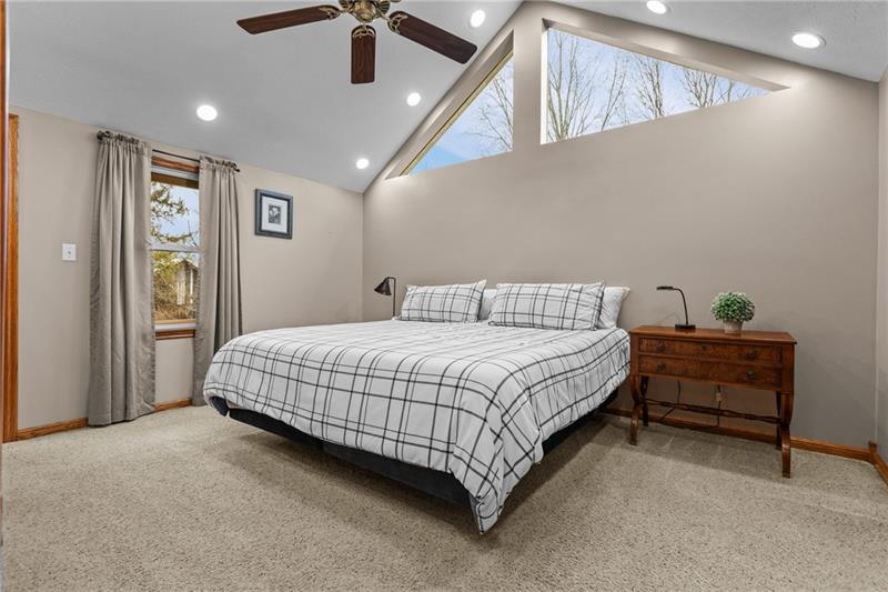 100 Daugherty Road Grove City, PA 16127 - Photo 22 of 48 a spacious bedroom with a bed and a ceiling fan