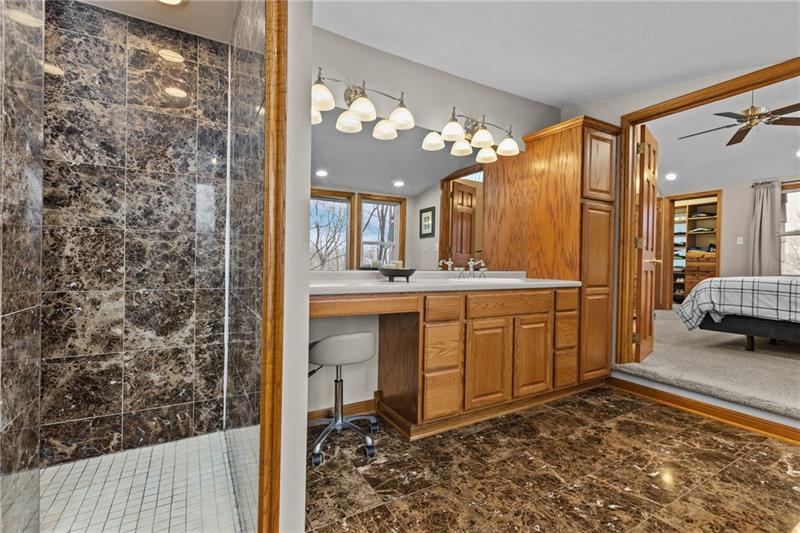 100 Daugherty Road Grove City, PA 16127 - Photo 24 of 48 a bathroom with a sink mirror and a shower