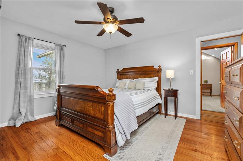 100 Daugherty Road Grove City, PA 16127 - Photo 28 of 48 a bedroom with a bed and a chandelier
