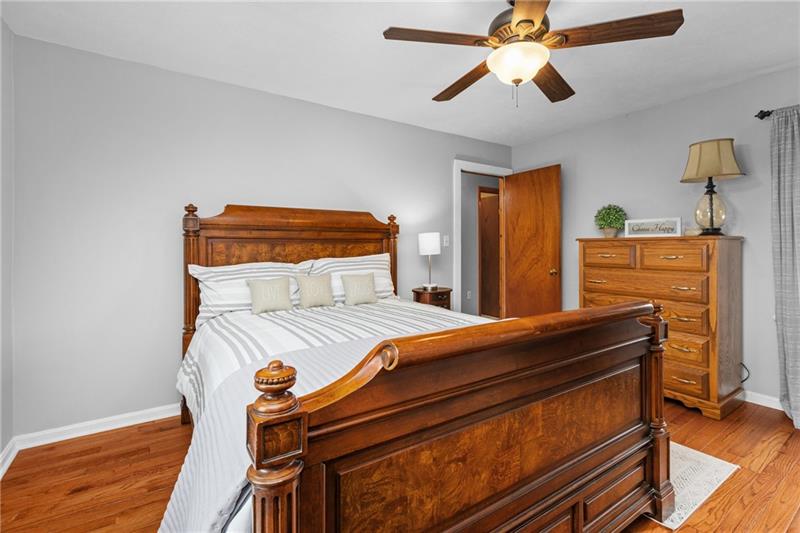 100 Daugherty Road Grove City, PA 16127 - Photo 29 of 48 a bedroom with a bed and wooden floor