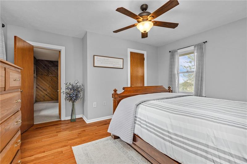 100 Daugherty Road Grove City, PA 16127 - Photo 30 of 48 a bedroom with a large bed and a chandelier