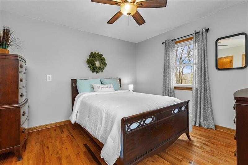100 Daugherty Road Grove City, PA 16127 - Photo 32 of 48 a bed sitting in a bedroom next to a window