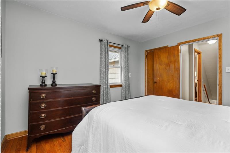 100 Daugherty Road Grove City, PA 16127 - Photo 33 of 48 a bedroom with a bed and a chandelier